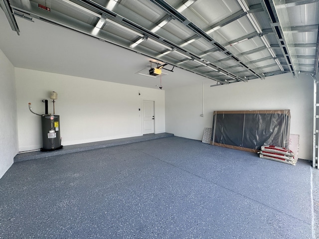 4657 SW Keats St, Port Saint Lucie, FL 34953 - garage with a garage door opener and electric water heater
