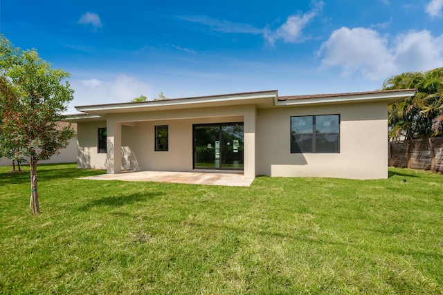 4657 SW Keats St, Port Saint Lucie, FL 34953 - back of house featuring stucco siding and a patio area