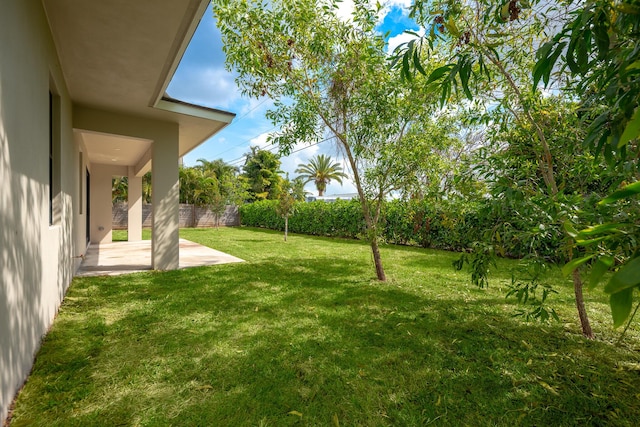 4657 SW Keats St, Port Saint Lucie, FL 34953 - fenced backyard with a patio area