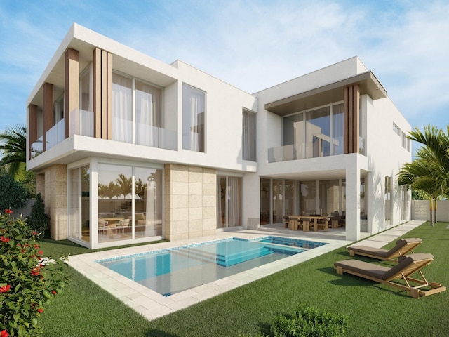 305 Grove Pl, Delray Beach, FL 33444 - back of house with a balcony, a patio area, a yard, and an outdoor pool