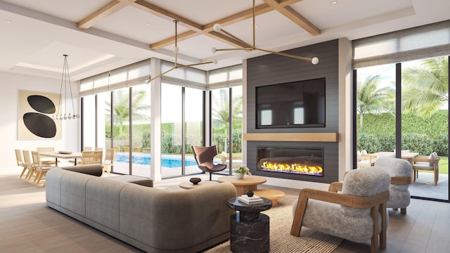 305 Grove Pl, Delray Beach, FL 33444 - living area with coffered ceiling, healthy amount of natural light, wood finished floors, floor to ceiling windows, and a fireplace