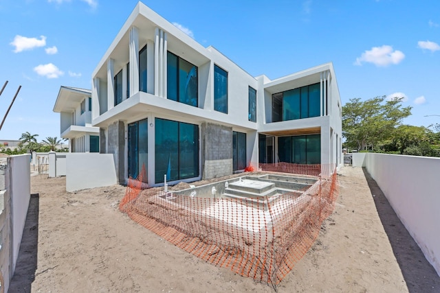 305 Grove Pl, Delray Beach, FL 33444 - rear view of property with a fenced backyard and stucco siding