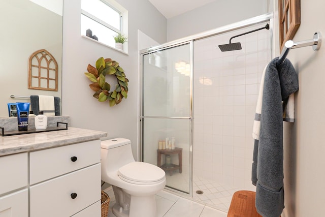 full bathroom with vanity, a tile shower, and toilet