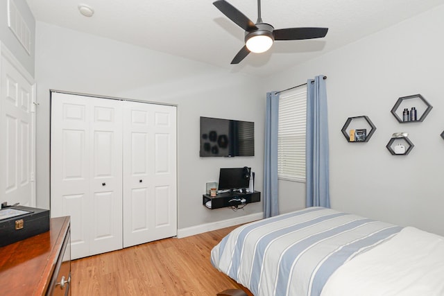 bedroom featuring a ceiling fan, a closet, light wood-style flooring, and visible vents