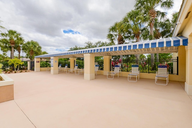 view of property's community with a patio and fence