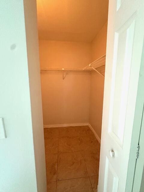 walk in closet featuring tile patterned floors