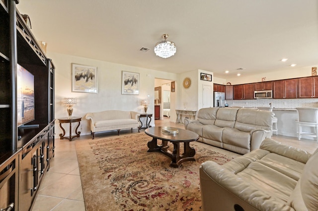 7384 NW Greenspring St, Port Saint Lucie, FL 34987 - living room with light tile patterned floors and recessed lighting