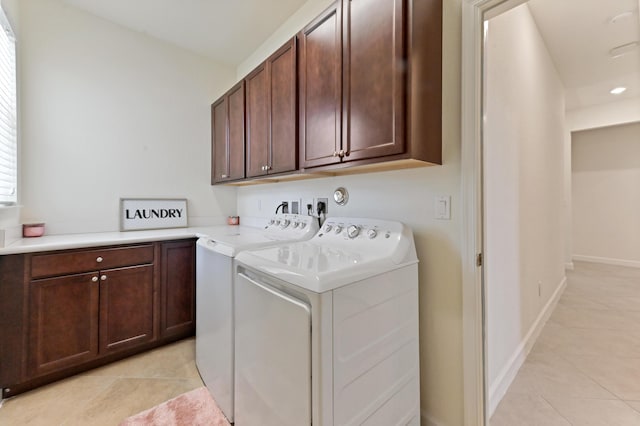 7384 NW Greenspring St, Port Saint Lucie, FL 34987 - washroom with cabinet space, washing machine and dryer, and light tile patterned flooring