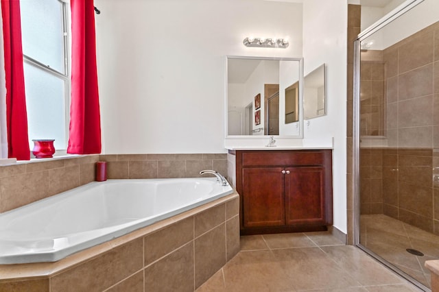 7384 NW Greenspring St, Port Saint Lucie, FL 34987 - full bath featuring a stall shower, vanity, tile patterned floors, a garden tub, and plenty of natural light