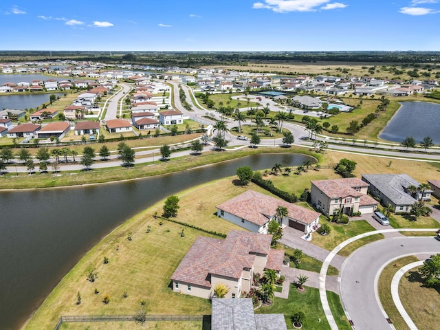 7384 NW Greenspring St, Port Saint Lucie, FL 34987 - aerial view of property's location with a large body of water and nearby suburban area