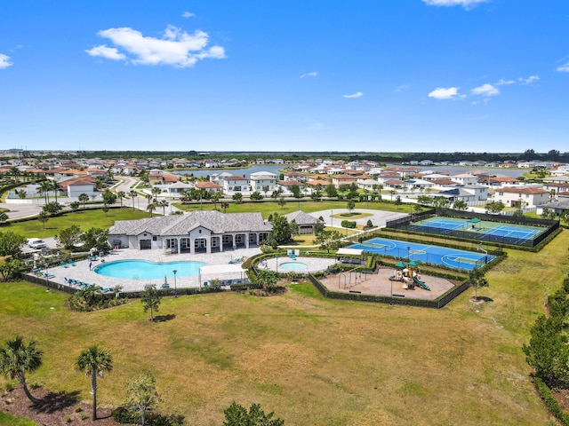 7384 NW Greenspring St, Port Saint Lucie, FL 34987 - aerial perspective of suburban area with a pool
