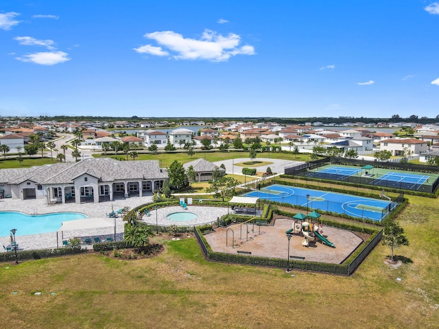 7384 NW Greenspring St, Port Saint Lucie, FL 34987 - aerial perspective of suburban area with a pool area