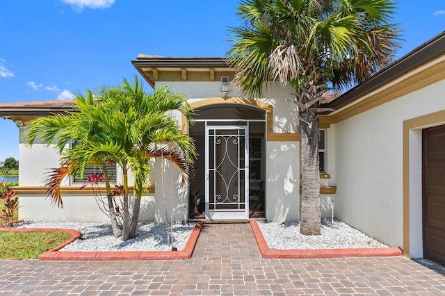 7384 NW Greenspring St, Port Saint Lucie, FL 34987 - property entrance featuring stucco siding