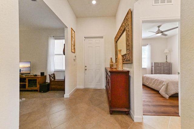 7384 NW Greenspring St, Port Saint Lucie, FL 34987 - hall with tile patterned flooring and baseboards