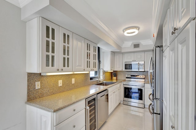 5380 N Ocean Dr Unit 5A, Riviera Beach, FL 33404 - kitchen with a sink, dishwasher, white cabinetry, wine cooler, and glass insert cabinets