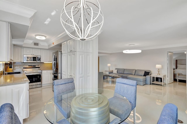 5380 N Ocean Dr Unit 5A, Riviera Beach, FL 33404 - dining space with a water view, baseboards, and an inviting chandelier