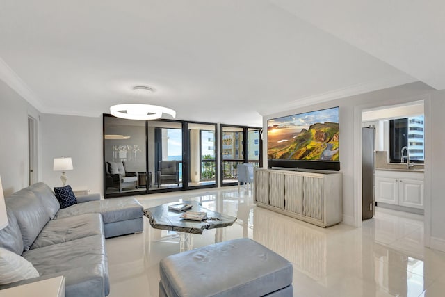 5380 N Ocean Dr Unit 5A, Riviera Beach, FL 33404 - living room featuring ornamental molding, light tile patterned floors, a healthy amount of sunlight, and a wall of windows