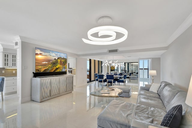 5380 N Ocean Dr Unit 5A, Riviera Beach, FL 33404 - living room with visible vents, ornamental molding, a raised ceiling, light tile patterned floors, and a notable chandelier
