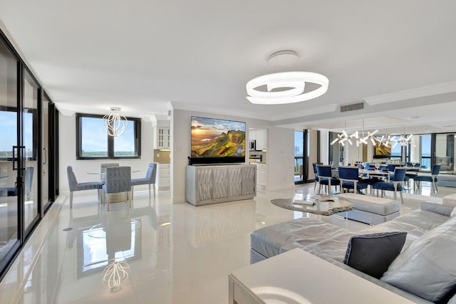 5380 N Ocean Dr Unit 5A, Riviera Beach, FL 33404 - living room with visible vents, a raised ceiling, light tile patterned floors, and a chandelier