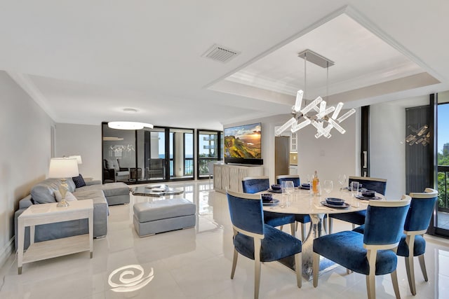 5380 N Ocean Dr Unit 5A, Riviera Beach, FL 33404 - living room featuring tile patterned floors, ornamental molding, a chandelier, and visible vents