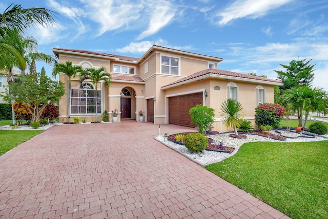 8841 Cobblestone Point Cir, Boynton Beach, FL 33472 - mediterranean / spanish-style house featuring decorative driveway, a tile roof, and stucco siding