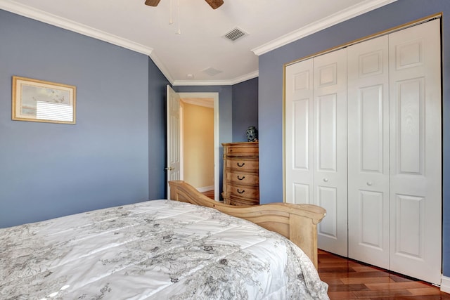 8841 Cobblestone Point Cir, Boynton Beach, FL 33472 - bedroom with a closet, visible vents, ornamental molding, and dark wood-type flooring