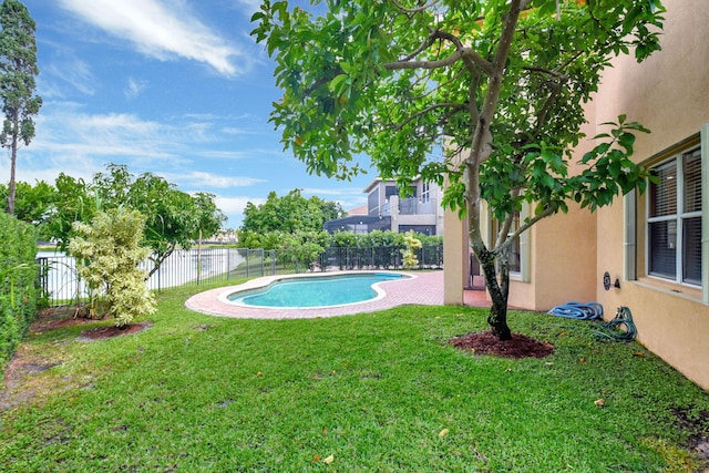 8841 Cobblestone Point Cir, Boynton Beach, FL 33472 - view of swimming pool featuring a fenced backyard, a fenced in pool, a water view, a patio area, and a yard