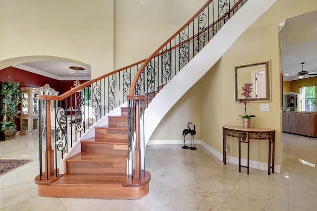 8841 Cobblestone Point Cir, Boynton Beach, FL 33472 - staircase with ceiling fan, arched walkways, marble finish floor, baseboards, and ornamental molding