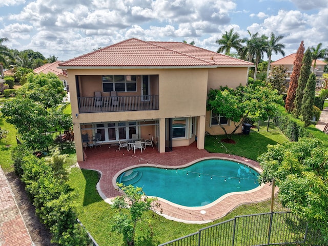8841 Cobblestone Point Cir, Boynton Beach, FL 33472 - rear view of house featuring a patio, a fenced backyard, stucco siding, a yard, and a tile roof