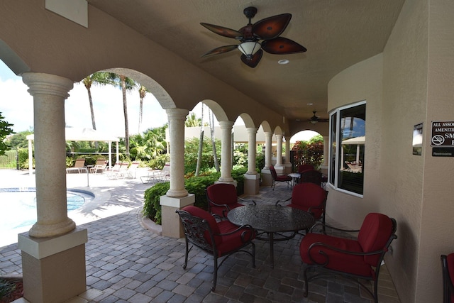 8841 Cobblestone Point Cir, Boynton Beach, FL 33472 - view of patio / terrace with ceiling fan and an outdoor pool