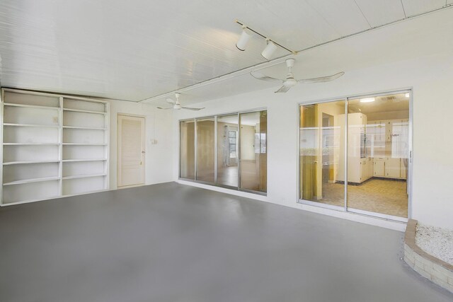 2886 Fernley Dr E Unit 69, West Palm Beach, FL 33415 - empty room featuring a ceiling fan and concrete flooring