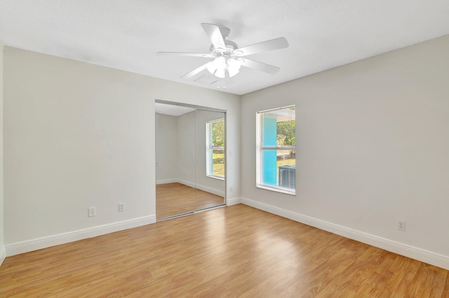 189 SE Floresta Dr, Port Saint Lucie, FL 34983 - unfurnished room with light wood-style flooring, baseboards, and a ceiling fan