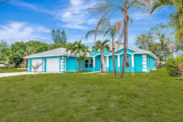 189 SE Floresta Dr, Port Saint Lucie, FL 34983 - view of front facade with an attached garage, driveway, and a front lawn