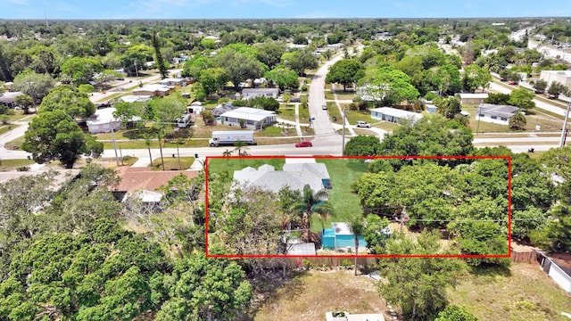 189 SE Floresta Dr, Port Saint Lucie, FL 34983 - aerial perspective of suburban area featuring property boundaries highlighted and a tree filled landscape
