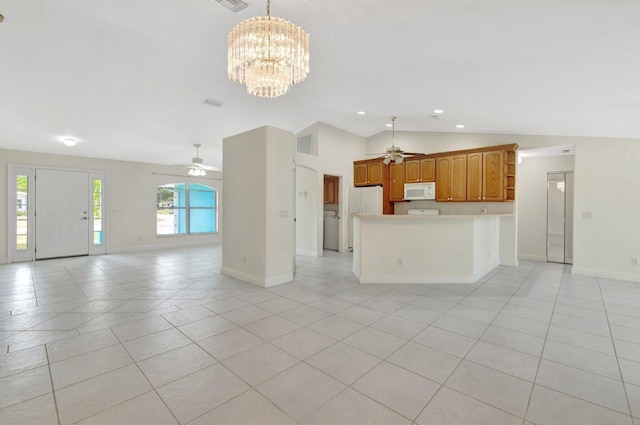 189 SE Floresta Dr, Port Saint Lucie, FL 34983 - unfurnished living room featuring ceiling fan, lofted ceiling, washer / clothes dryer, baseboards, and light tile patterned flooring