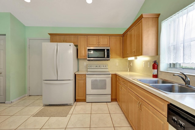 13006 Hampton Lakes Cir, Boynton Beach, FL 33436 - kitchen with white appliances, a sink, light countertops, light tile patterned floors, and recessed lighting