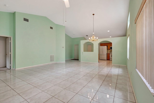 13006 Hampton Lakes Cir, Boynton Beach, FL 33436 - spare room featuring high vaulted ceiling, arched walkways, a chandelier, ceiling fan, and light tile patterned flooring