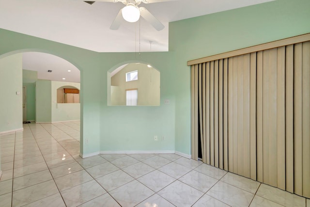13006 Hampton Lakes Cir, Boynton Beach, FL 33436 - unfurnished room featuring a ceiling fan, light tile patterned floors, and baseboards