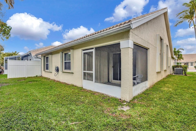 13006 Hampton Lakes Cir, Boynton Beach, FL 33436 - rear view of property with a sunroom, stucco siding, central AC unit, and a tiled roof