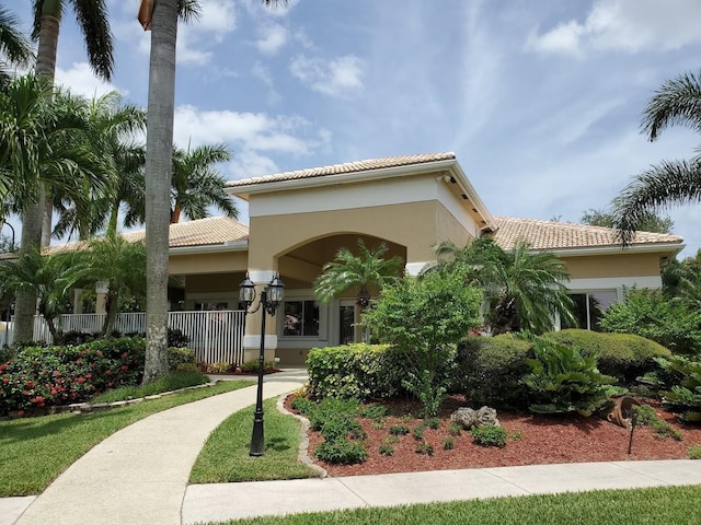 13006 Hampton Lakes Cir, Boynton Beach, FL 33436 - view of front of property with a tile roof and stucco siding