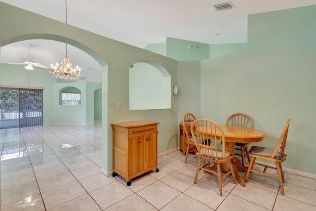 13006 Hampton Lakes Cir, Boynton Beach, FL 33436 - dining space featuring arched walkways, a ceiling fan, baseboards, a chandelier, and vaulted ceiling