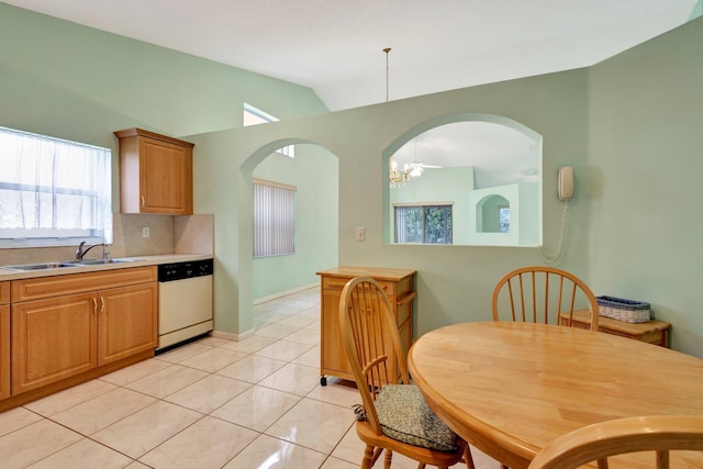 13006 Hampton Lakes Cir, Boynton Beach, FL 33436 - kitchen with dishwasher, vaulted ceiling, a sink, decorative backsplash, and light countertops