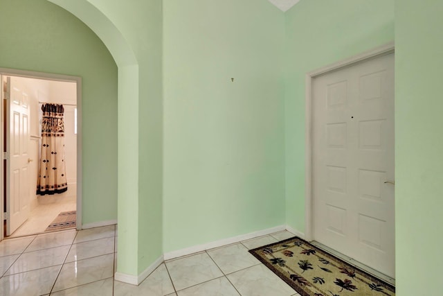 13006 Hampton Lakes Cir, Boynton Beach, FL 33436 - foyer featuring arched walkways, baseboards, and light tile patterned floors