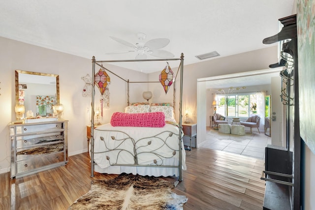 2971 SE Morningside Blvd, Port Saint Lucie, FL 34952 - bedroom featuring baseboards, wood finished floors, and visible vents