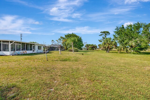 2971 SE Morningside Blvd, Port Saint Lucie, FL 34952 - view of yard with a sunroom