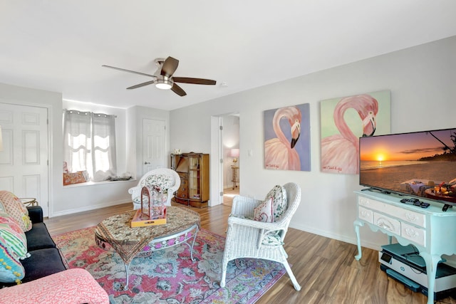 2971 SE Morningside Blvd, Port Saint Lucie, FL 34952 - living area featuring baseboards, a ceiling fan, and wood finished floors