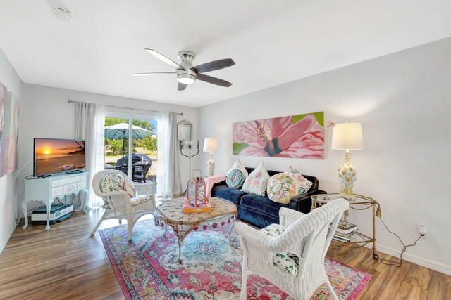 2971 SE Morningside Blvd, Port Saint Lucie, FL 34952 - living area with baseboards, a ceiling fan, and wood finished floors
