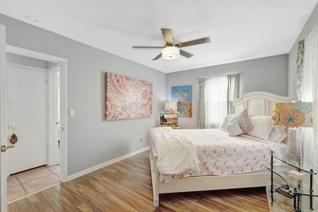 2971 SE Morningside Blvd, Port Saint Lucie, FL 34952 - bedroom with a ceiling fan, baseboards, and wood finished floors
