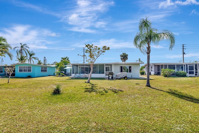 2971 SE Morningside Blvd, Port Saint Lucie, FL 34952 - exterior space with a sunroom and a front lawn