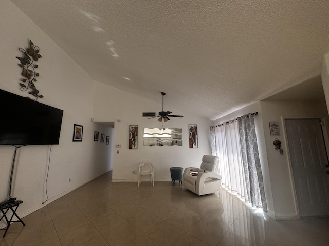 1101 Summit Place B Cir Unit B, West Palm Beach, FL 33415 - sitting room with vaulted ceiling, ceiling fan, a textured ceiling, baseboards, and tile patterned floors